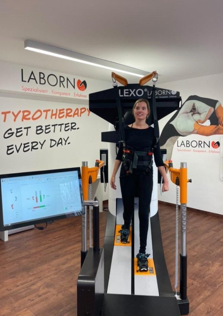 Woman is training on Lexo gait trainer