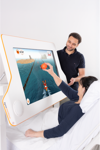 Woman trains with Myro while being in hospital bed