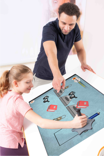 Child trains with Myro using an object