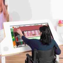 Woman trains with Myro while sitting in a wheelchair