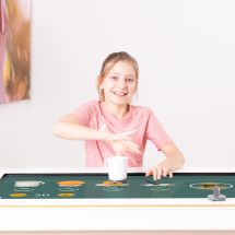 Child trains with Myro using a cup object