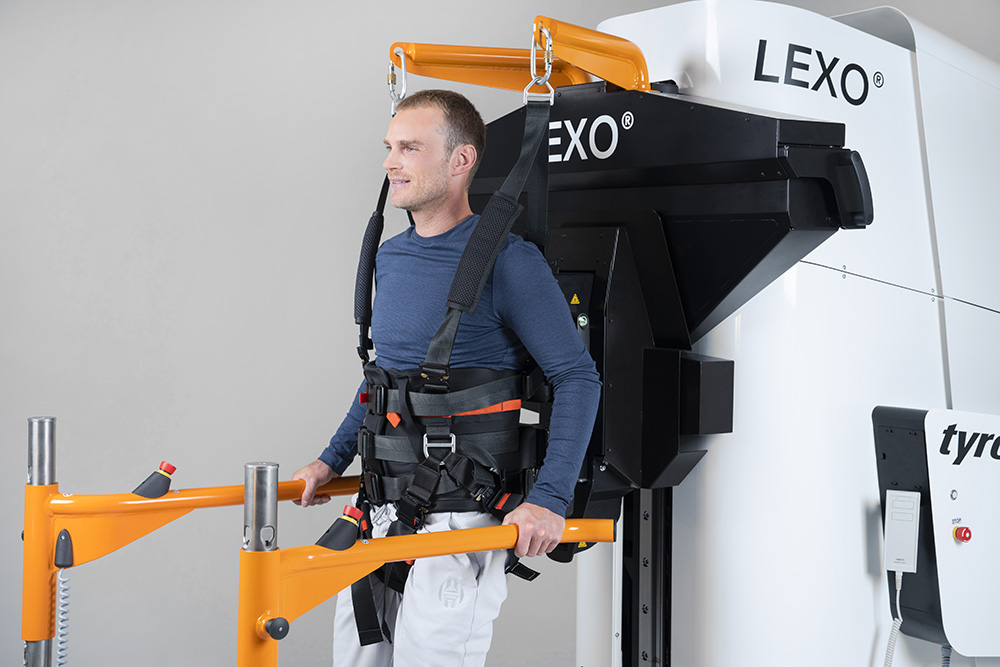Patient trains on robotic gait trainer Lexo