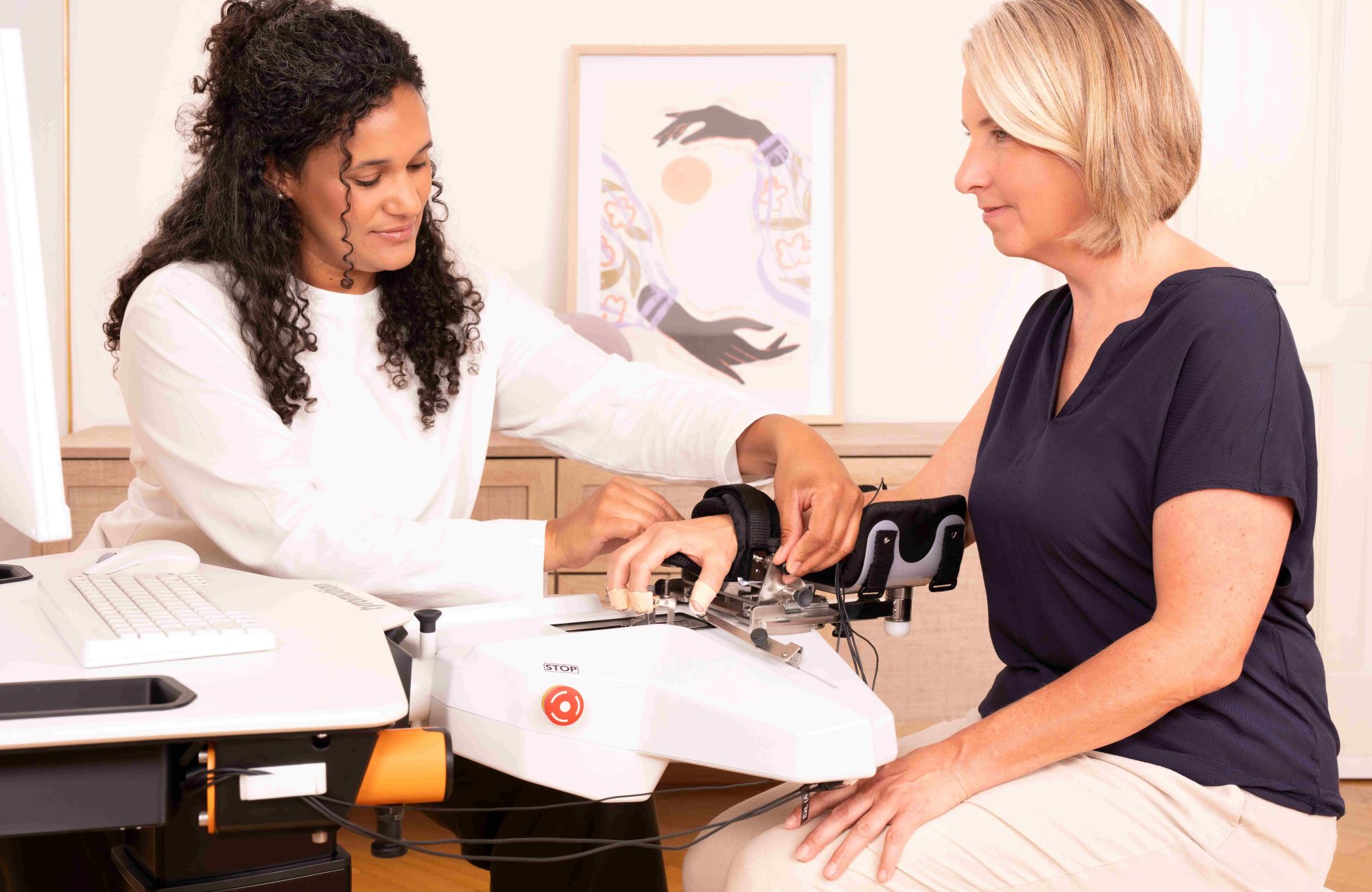 Woman and Therapist train with Amadeo