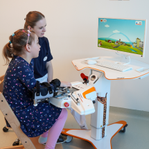 Child playing games while training on Amadeo