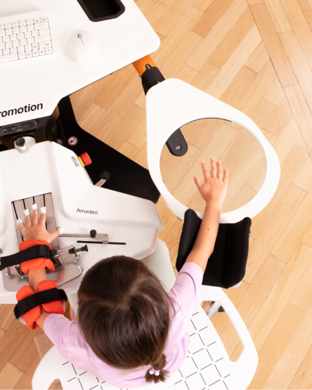 A child is training with the Amadeo RMT module