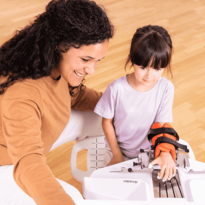 Therapist trains with young girl on Amadeo