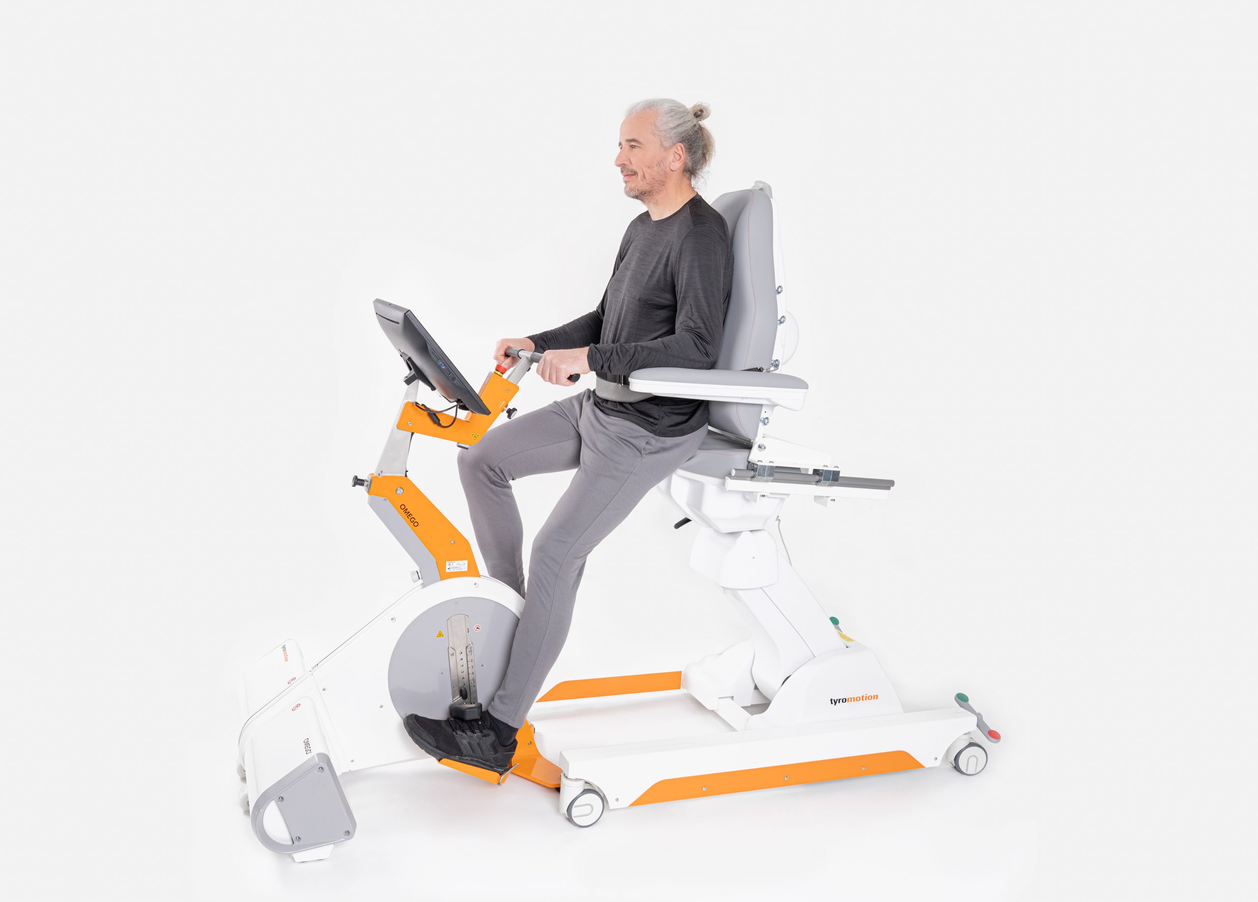 Patient on Omego Plus leg rehabilitation device