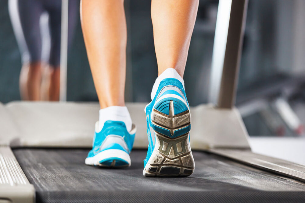 Stock Picture: Woman running on treadmill gym