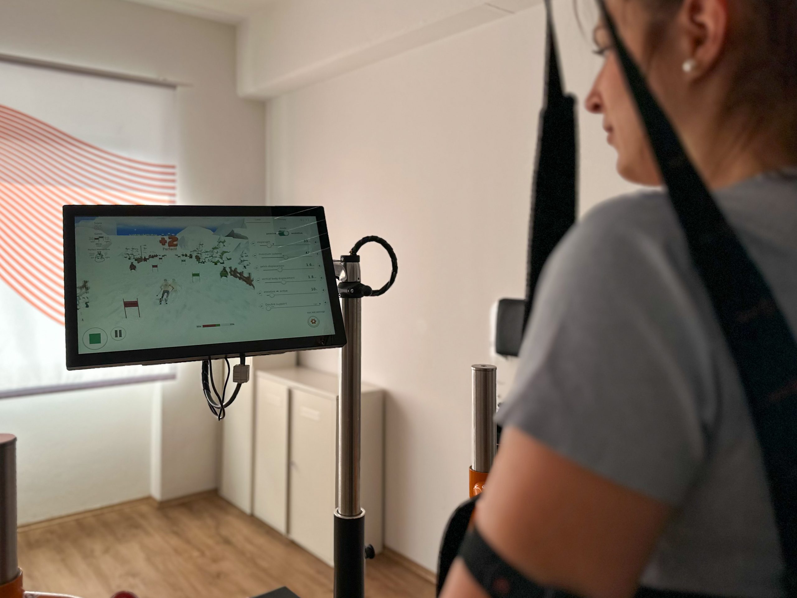 A patient in the Lexo gait trainer playing the new tyroS 6.8 game Ski Champion