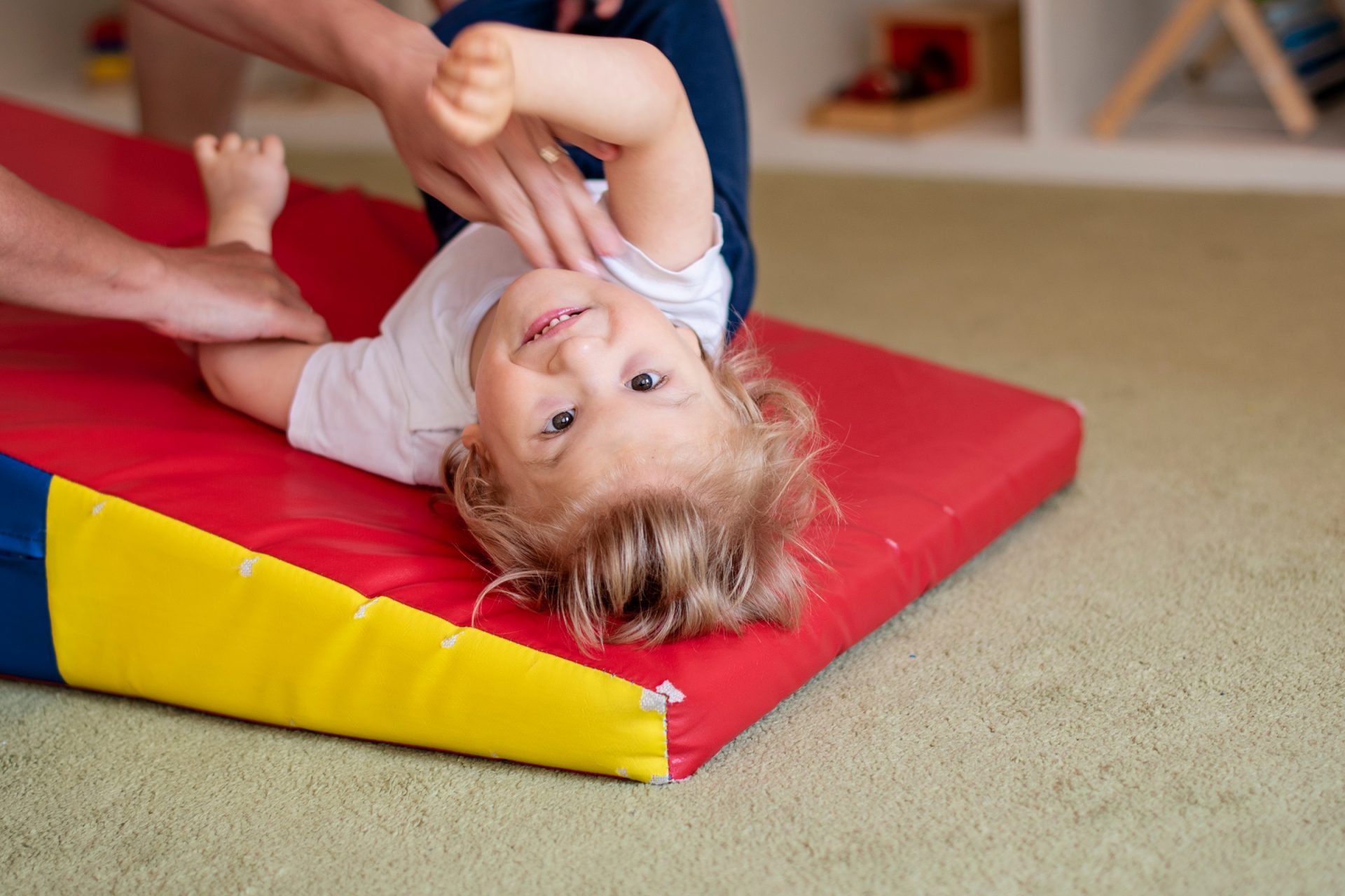 Picture of a female child with cerebral palsy on physiotherapy