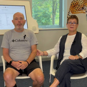 Patient Andy Dutton and his wife sitting in the therapy room from MOTIONrehab