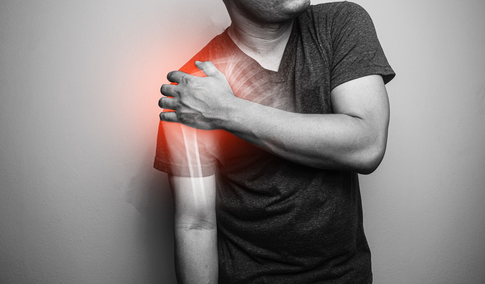 A close-up picture of a man and his shoulder clavicle fracture and pain.