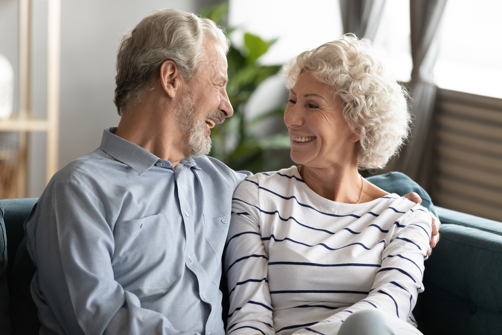 Two elderly people, a couple, sit and rest