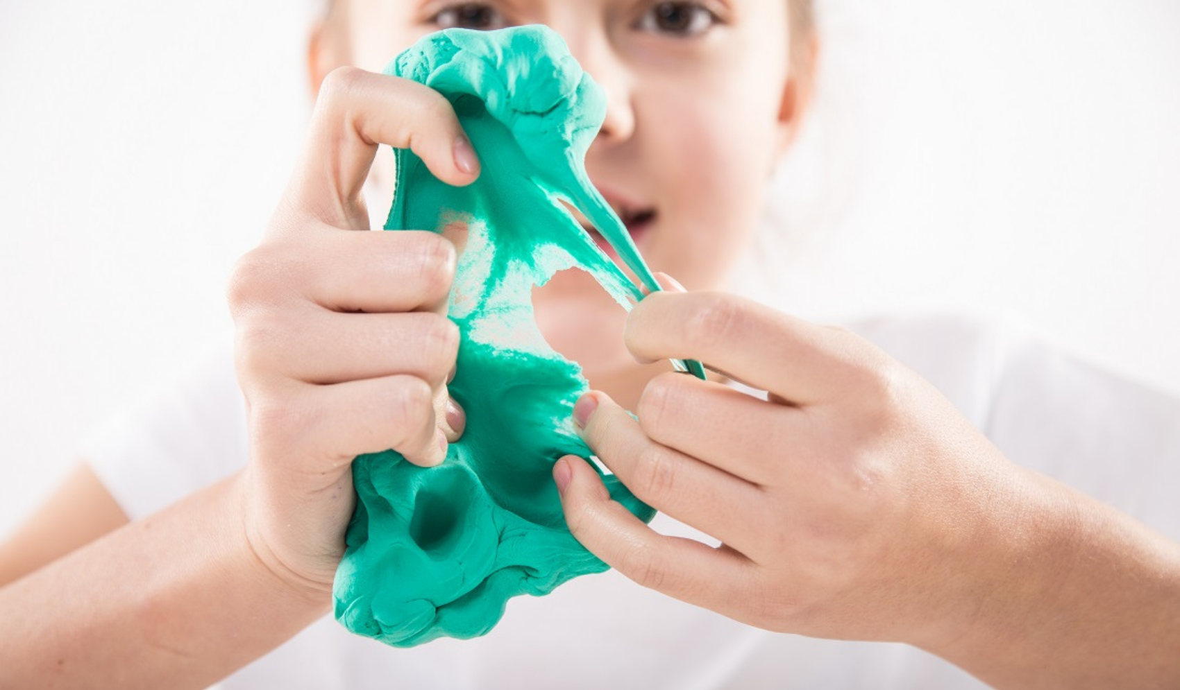 Picture of a male child playing with plasticine