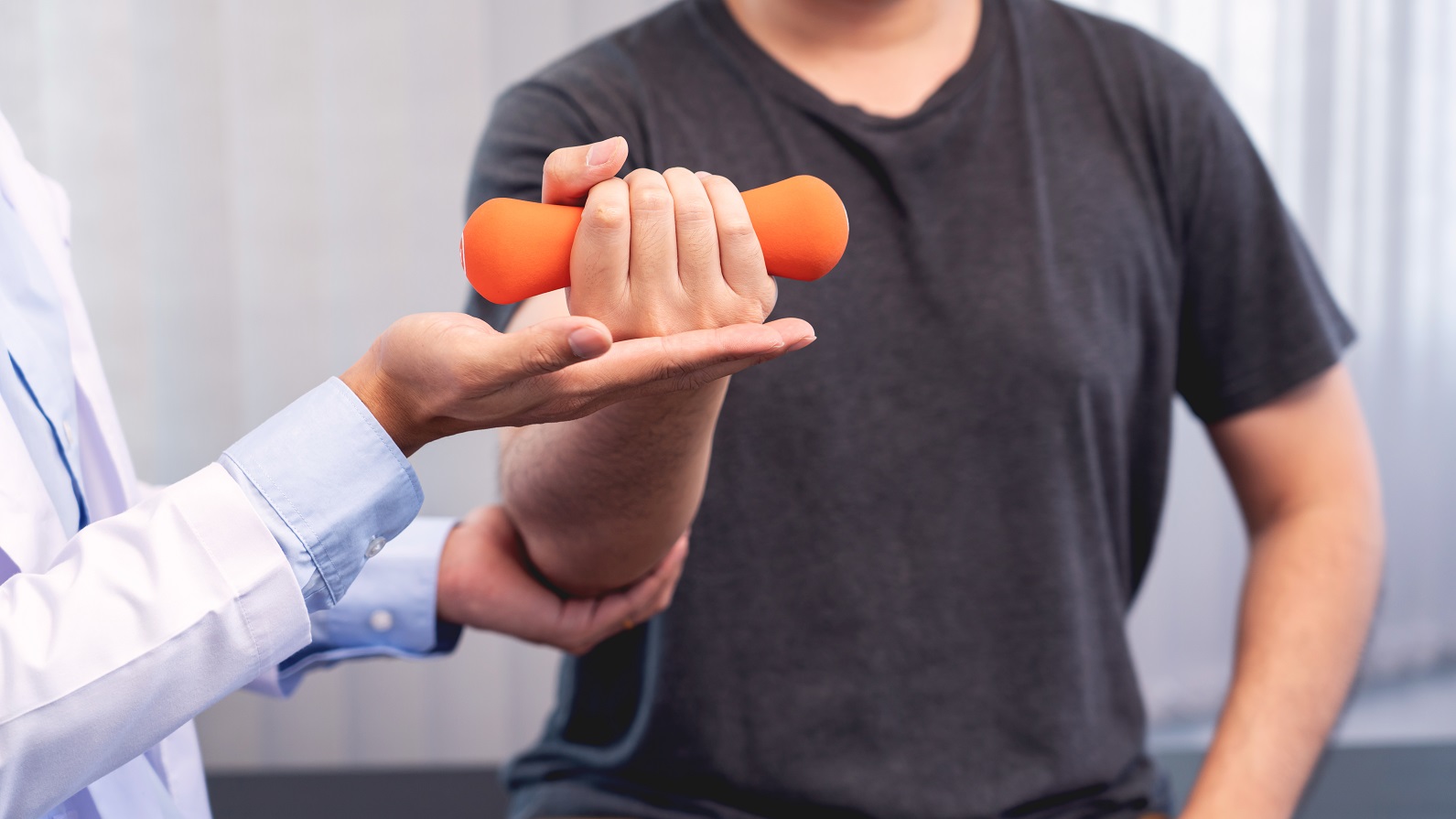 Doctor or physiotherapist giving physiotherapy to a patient